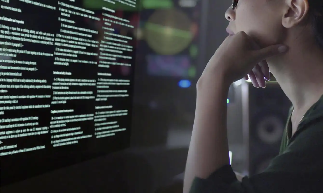 woman looking at lines of code